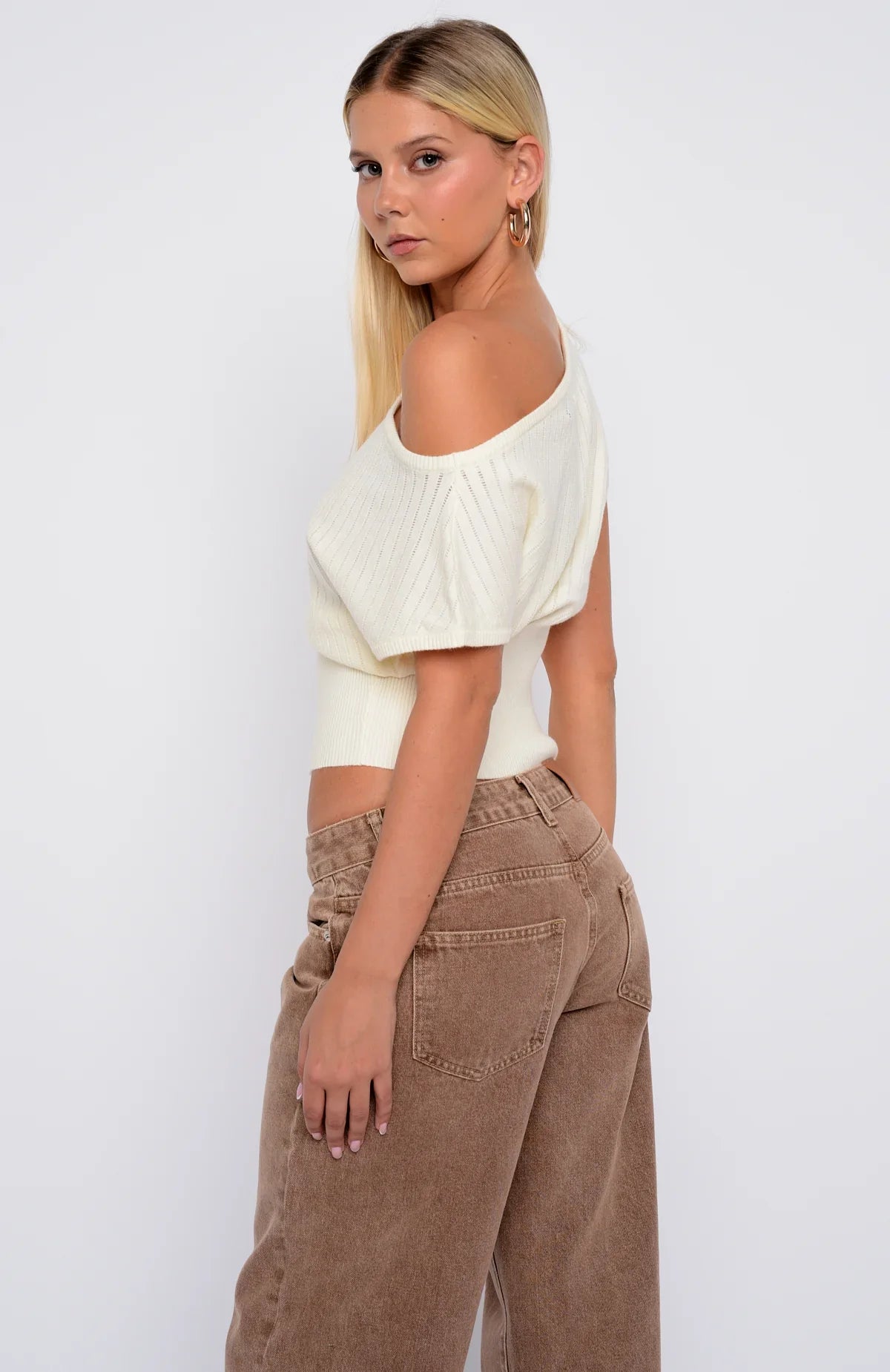 In A Spiral Cinched Waist Off Shoulder Knit Top Cream