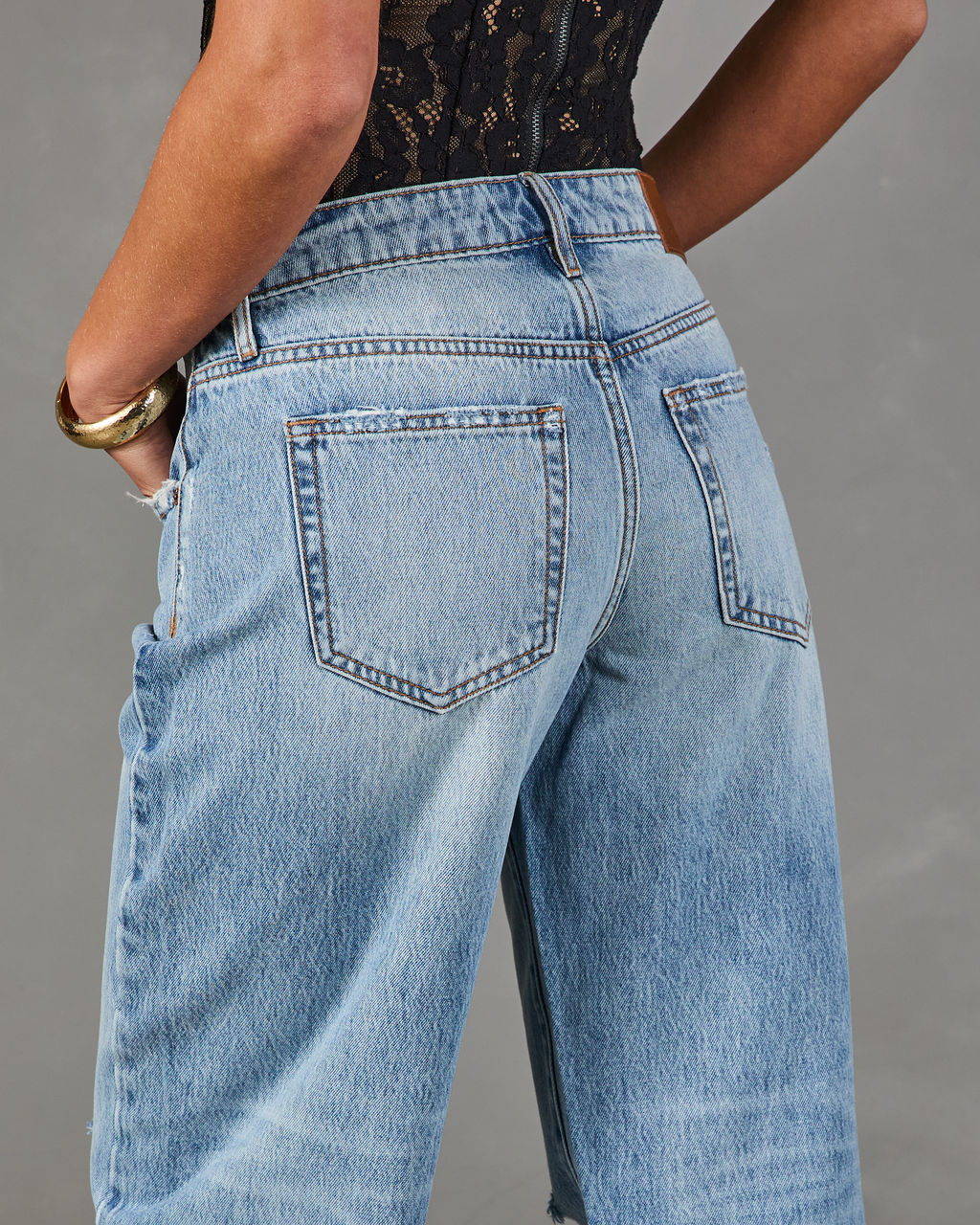 Reworked Frame Rigid Mid Rise Distressed Barrel Leg Jeans